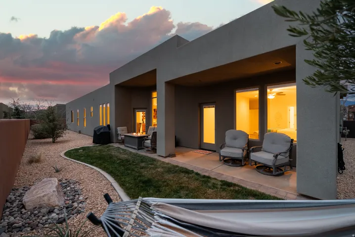 Exterior stucco facade with a covered patio