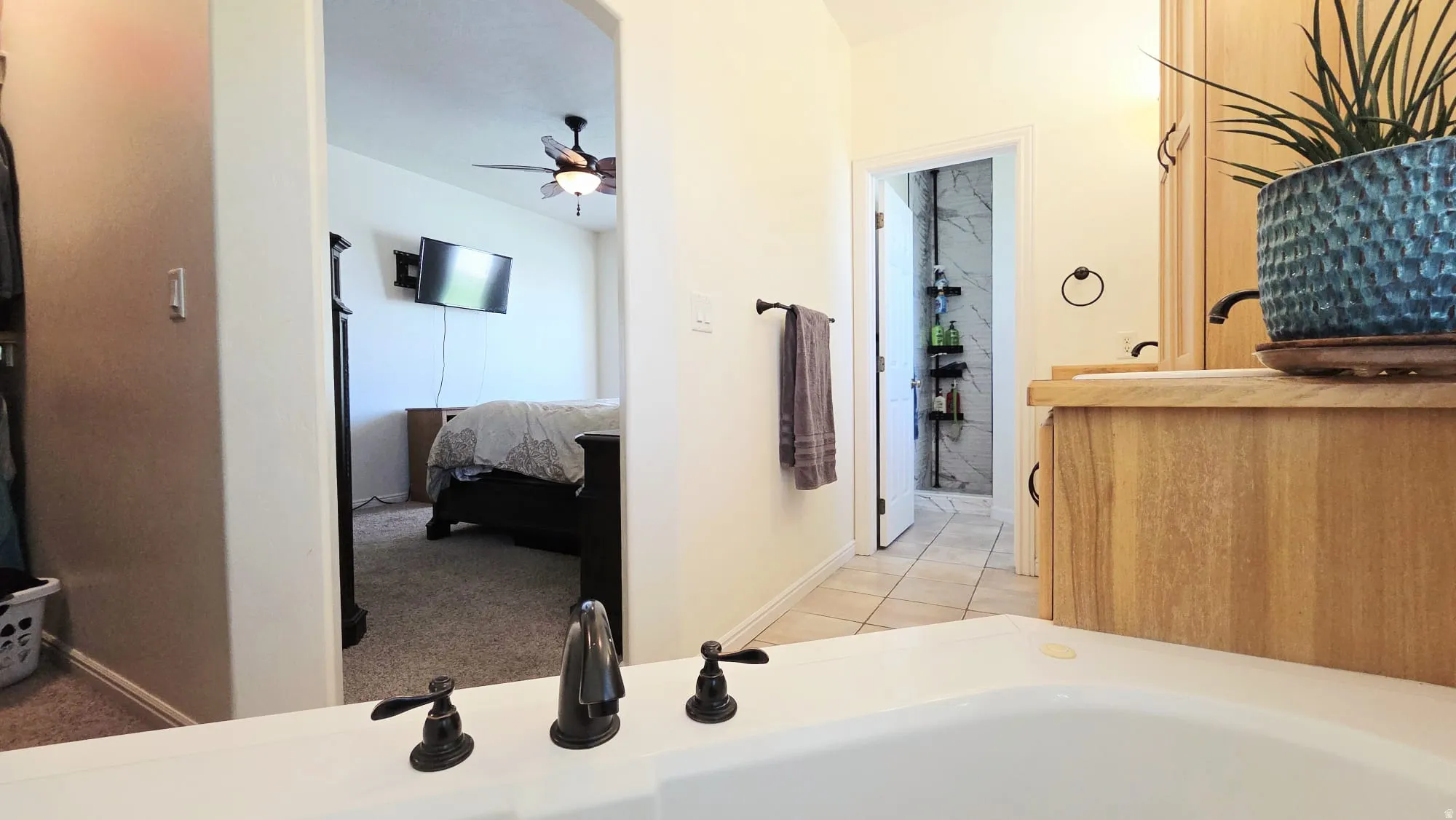 Soaking tub with bronze-finish fixtures