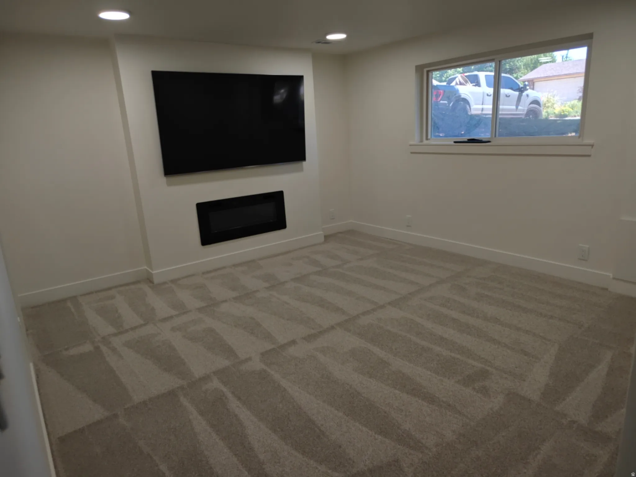 Recessed wall-mounted television and linear electric fireplace