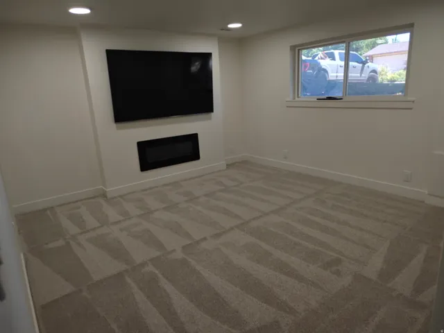 Recessed wall-mounted television and linear electric fireplace