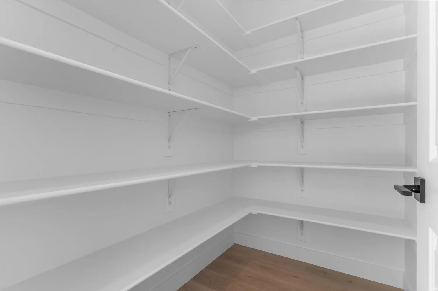 White shelving system providing extensive storage space