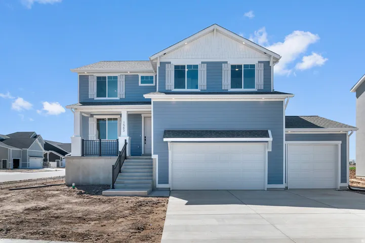 Blue siding exterior with white trim accents and a contrasting roof