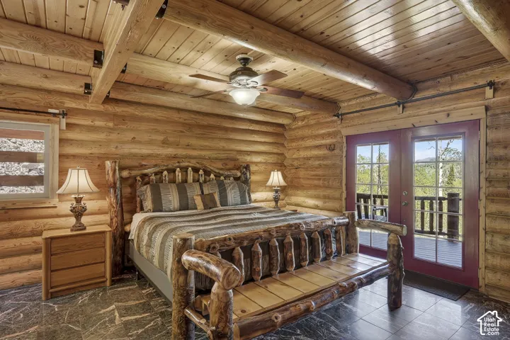 Solid log construction featuring exposed timber beams and wood-paneled ceilings
