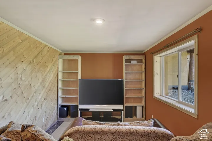 Living area featuring a wall with diagonal wood paneling and a contrasting painted accent wall
