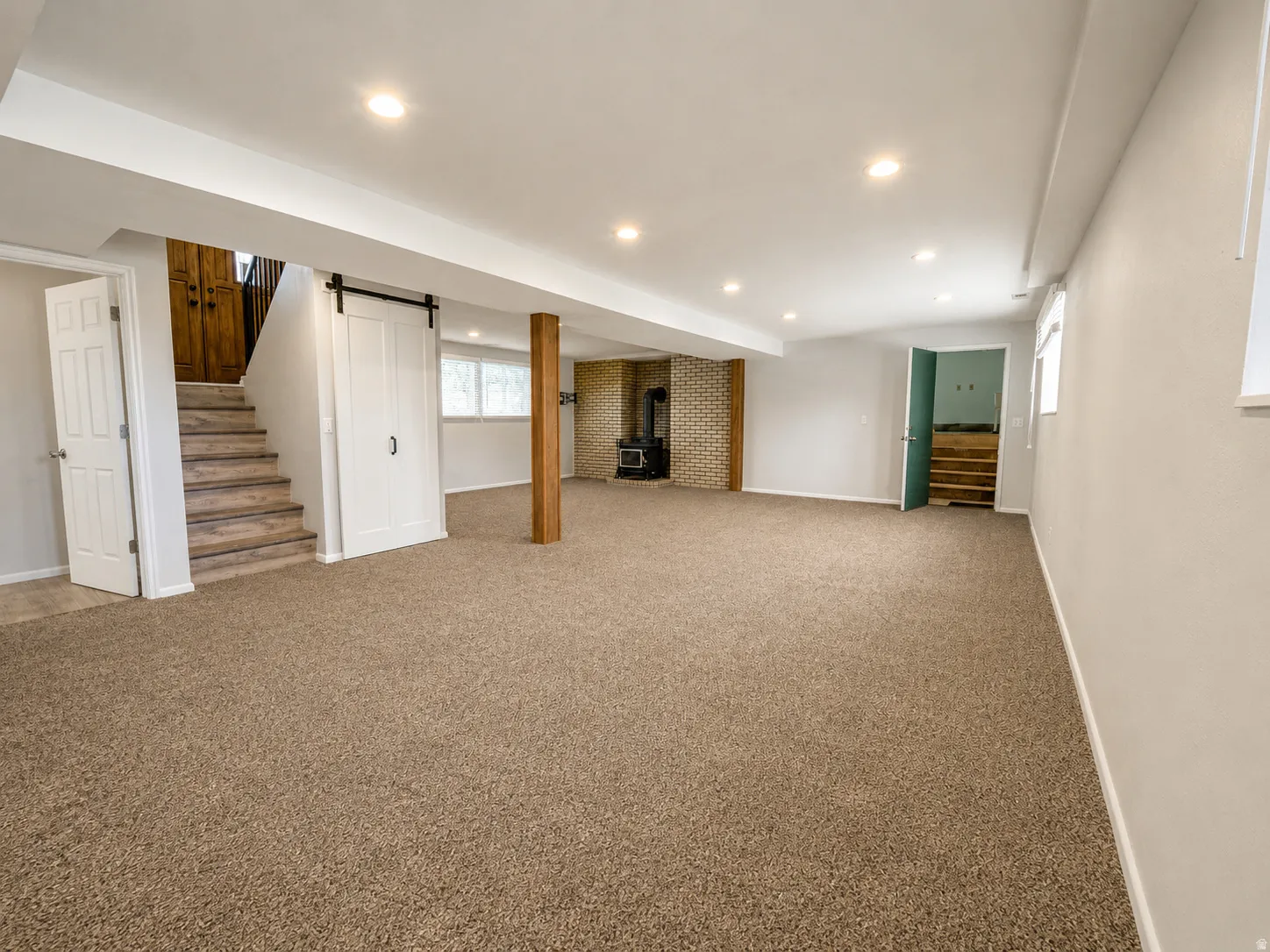 Spacious lower level featuring plush carpeting and recessed lighting