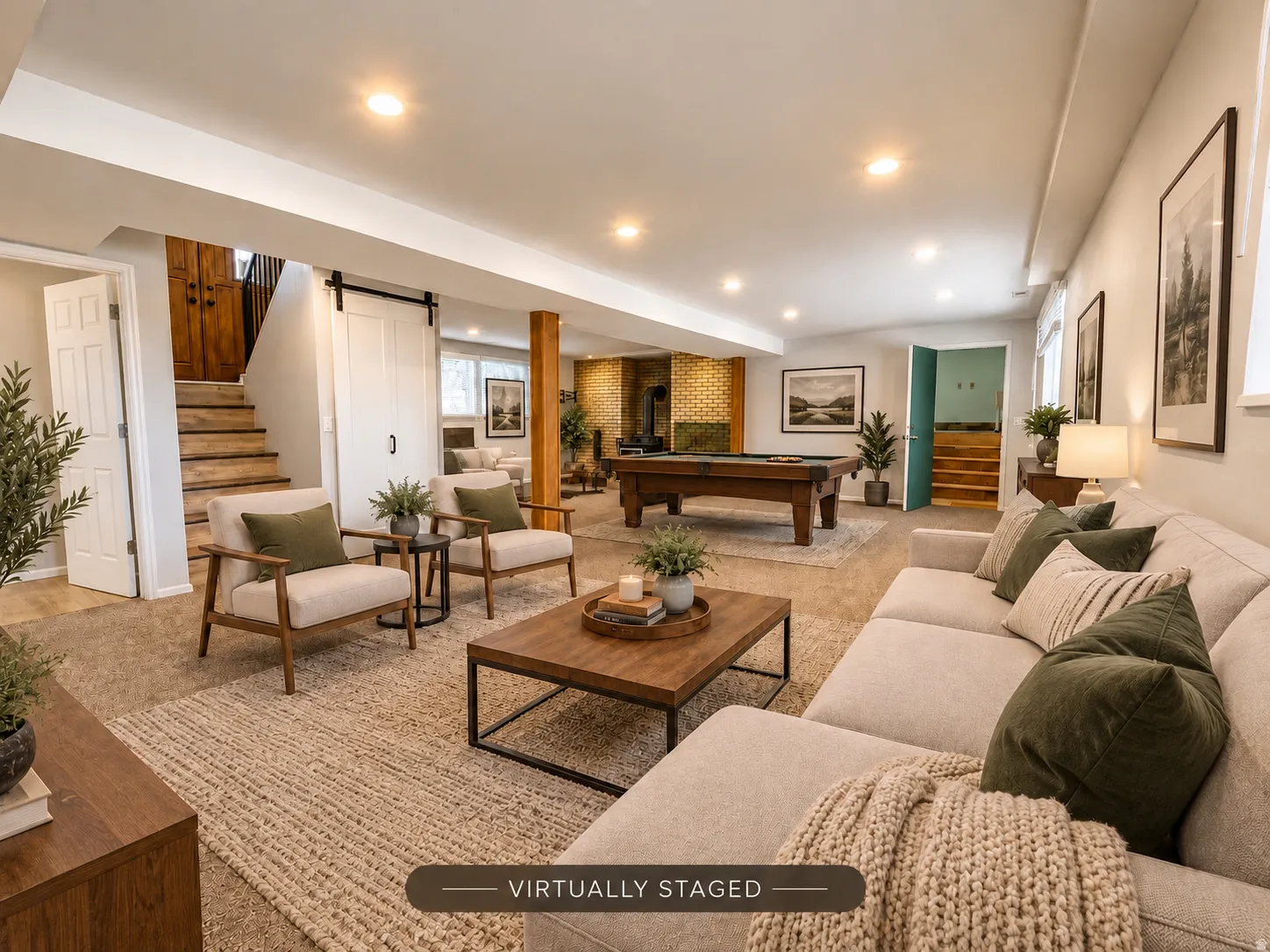 Recessed lighting, wood-finish stairs, a contemporary barn door, and a built-in wood-finish support beam