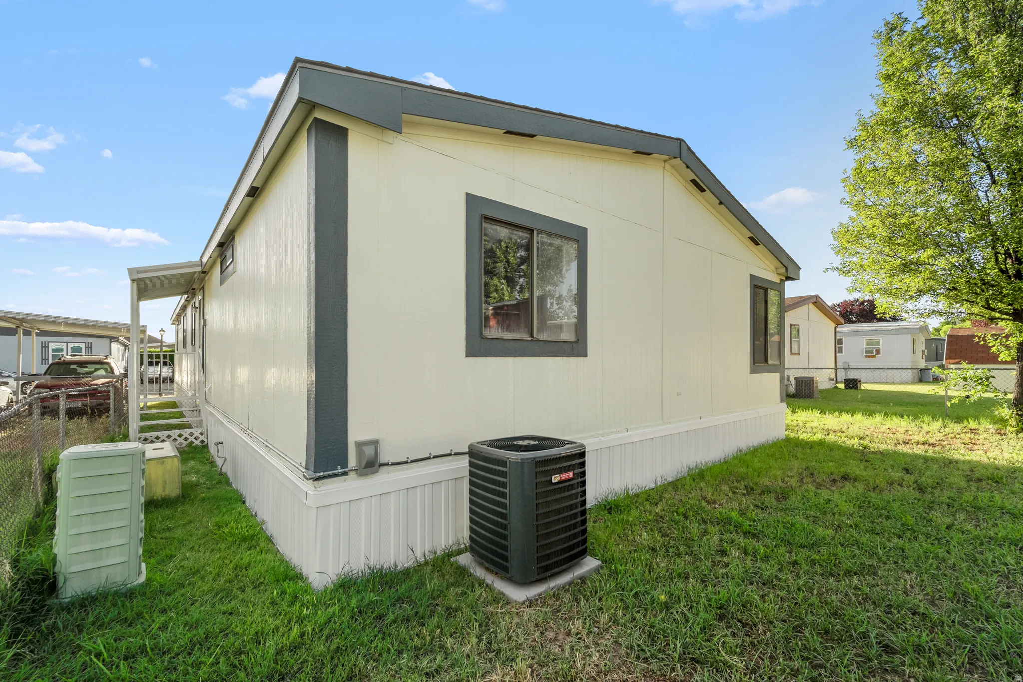 Light-toned siding exterior with dark trim and roofline