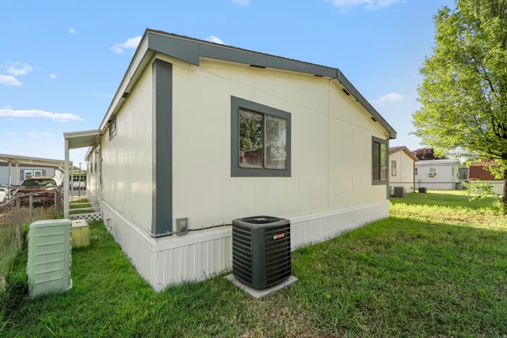 Light-toned siding exterior with dark trim and roofline