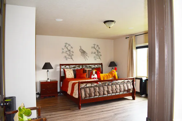 Spacious room featuring wood-finish flooring, recessed lighting, and a neutral color palette