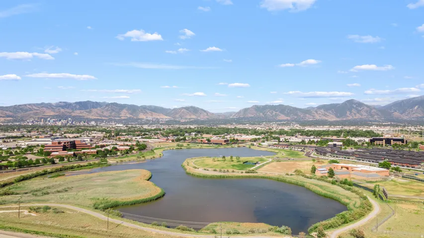 Expansive natural water feature with surrounding green spaces