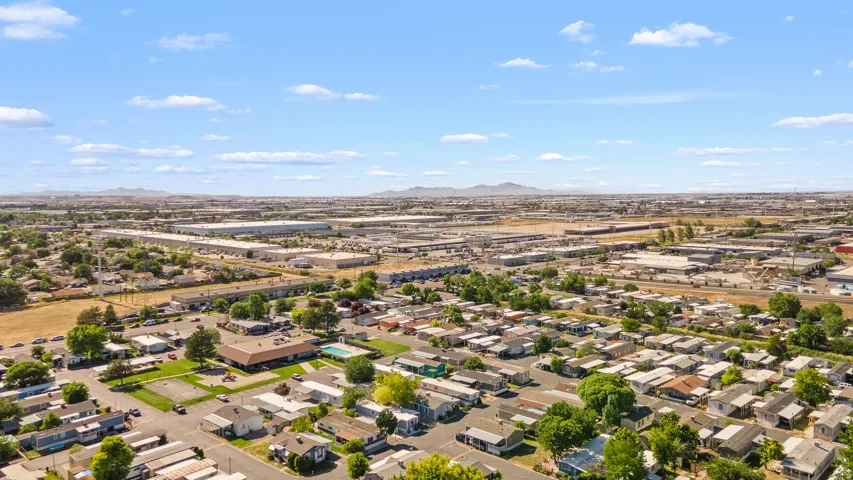 Aerial perspective showcasing a mixed-use landscape with residential and commercial properties