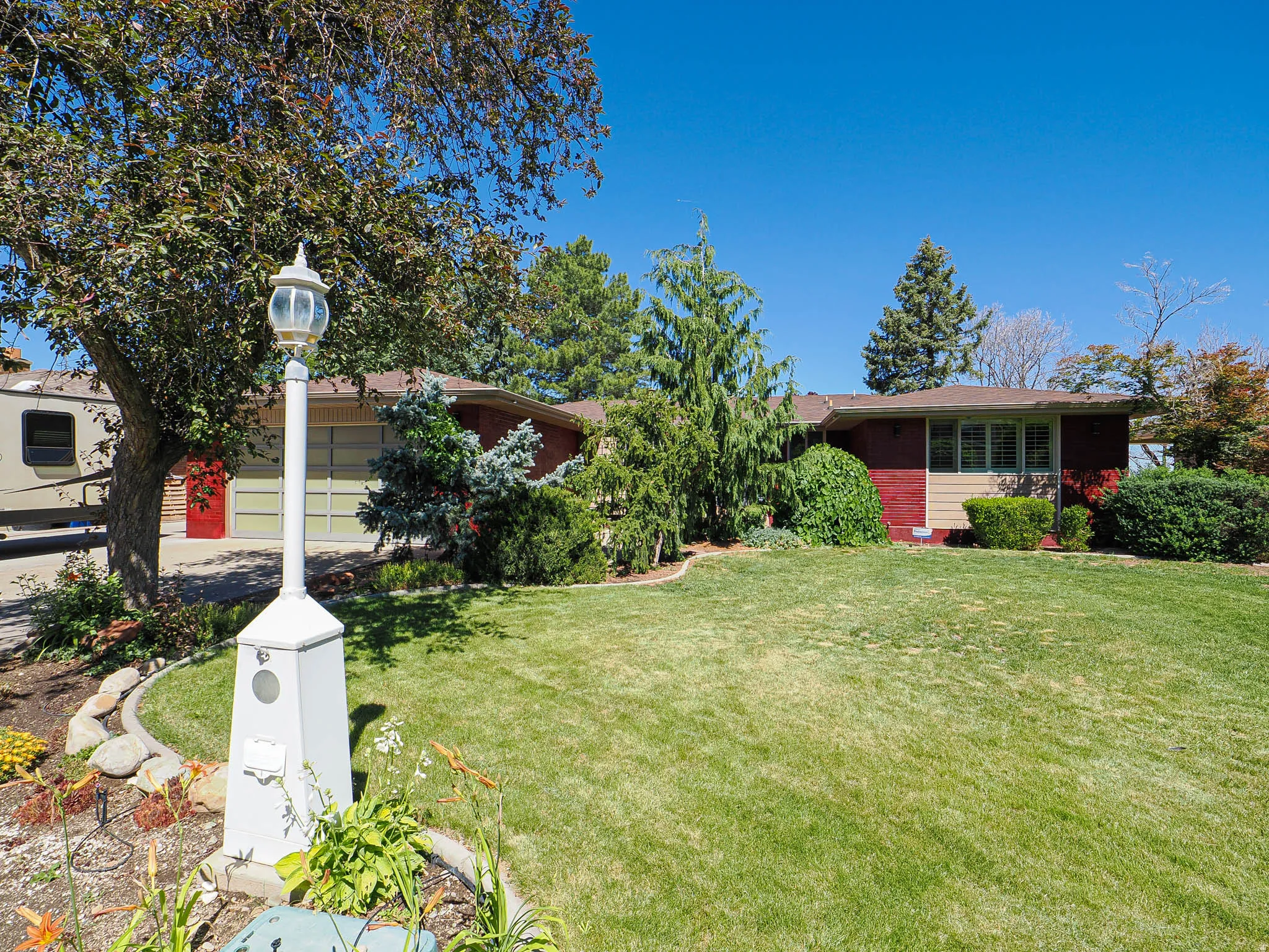 Ranch-style exterior with brick and siding facade