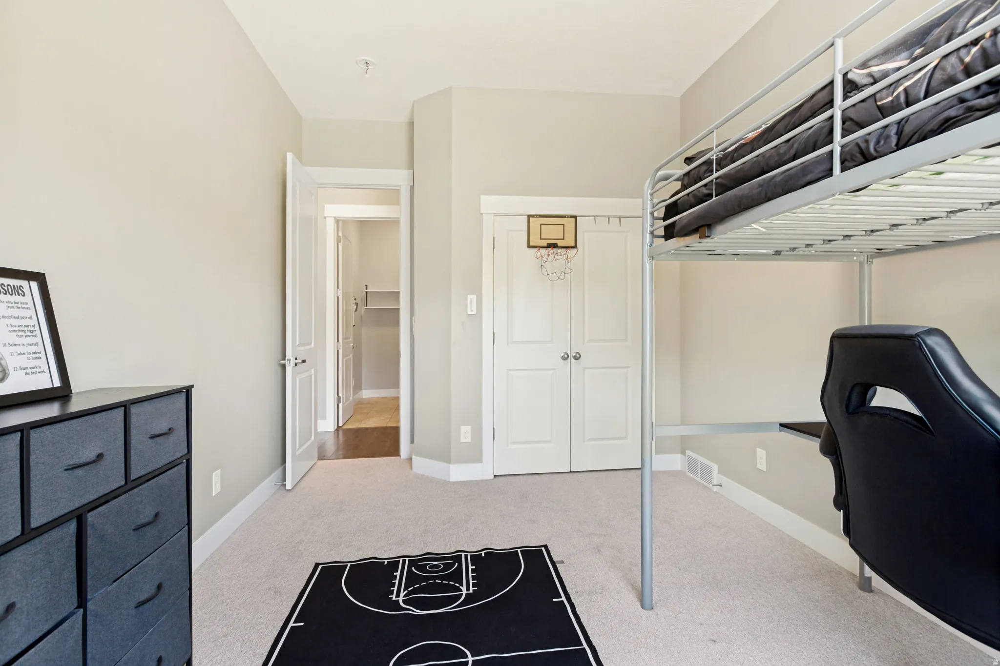 Neutral-toned walls complement light-colored carpeting