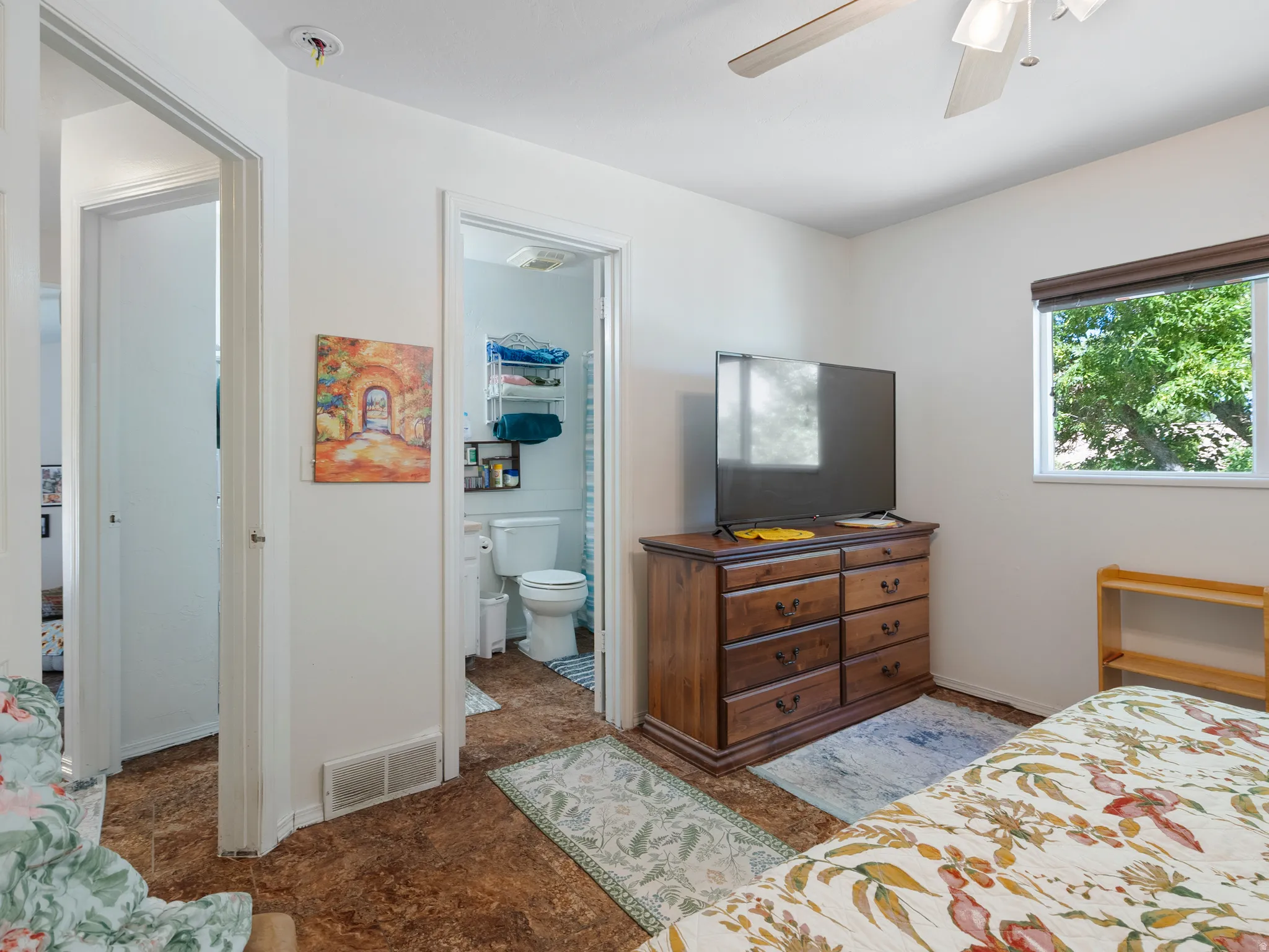 Interior room featuring wood-finish flooring and white walls