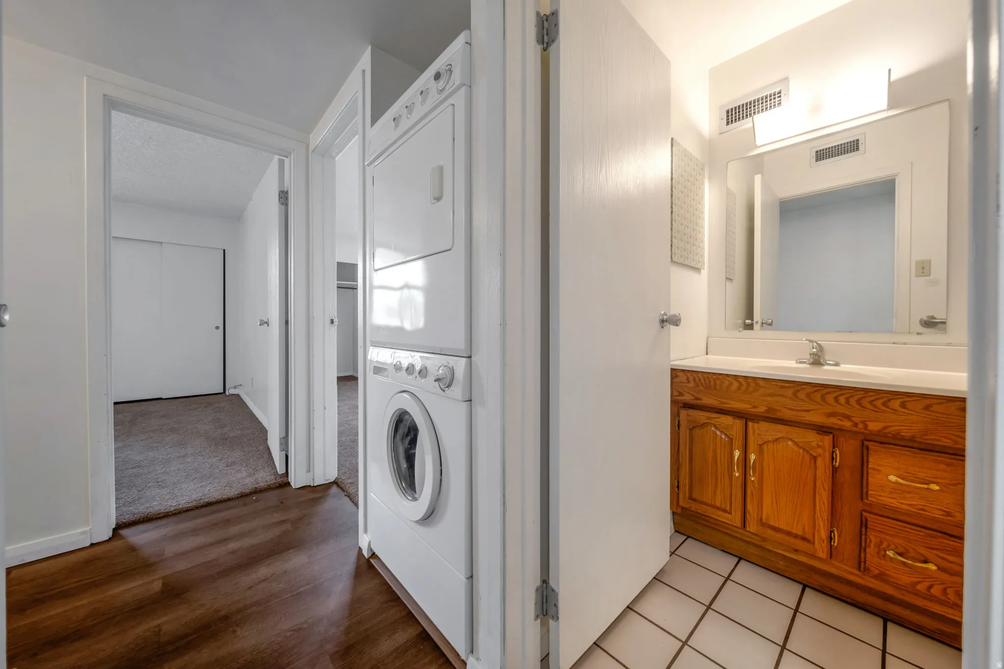 Laundry area with stackable washer and dryer units