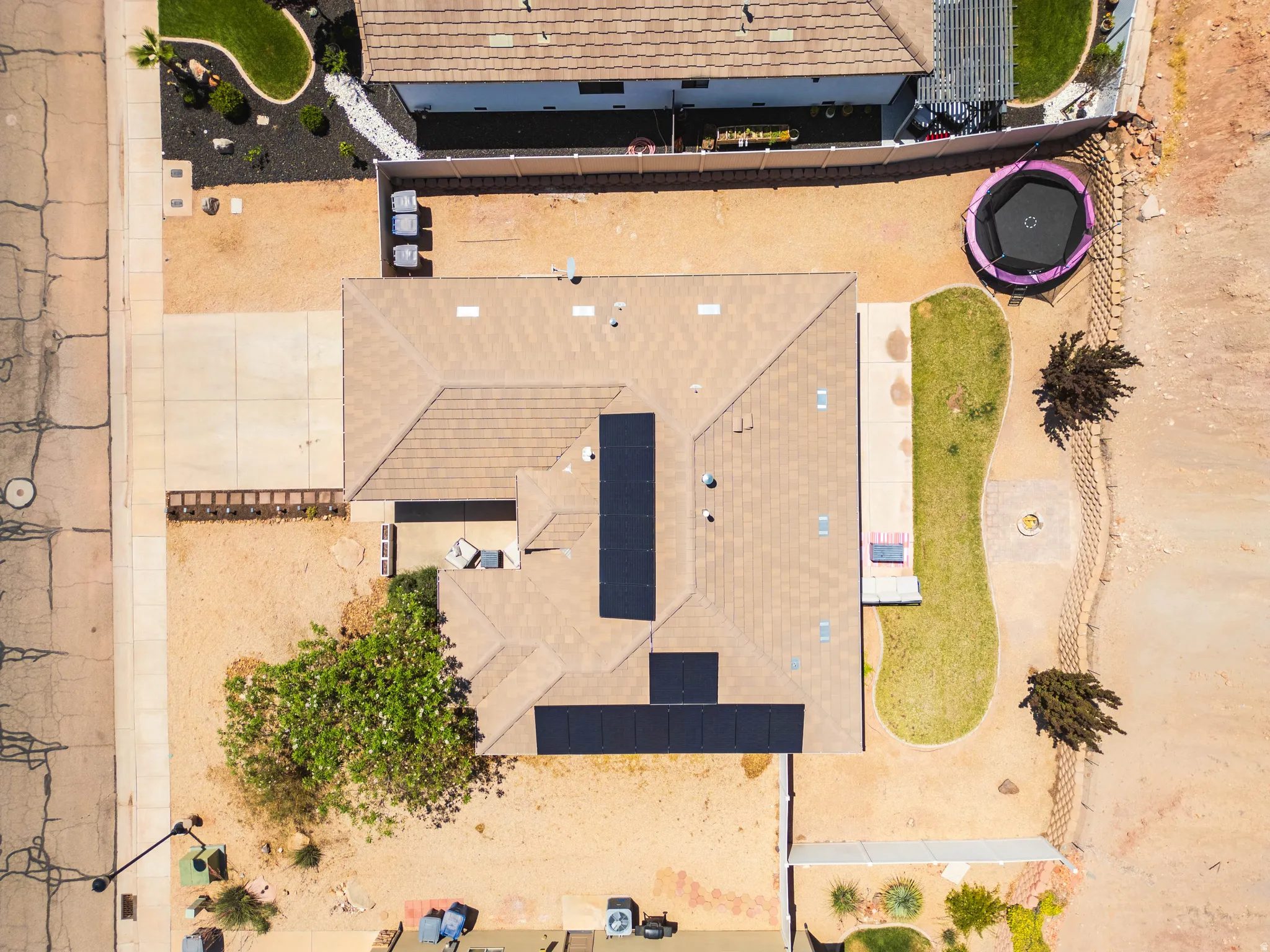Top-down aerial view showcasing the property along with the solar panels