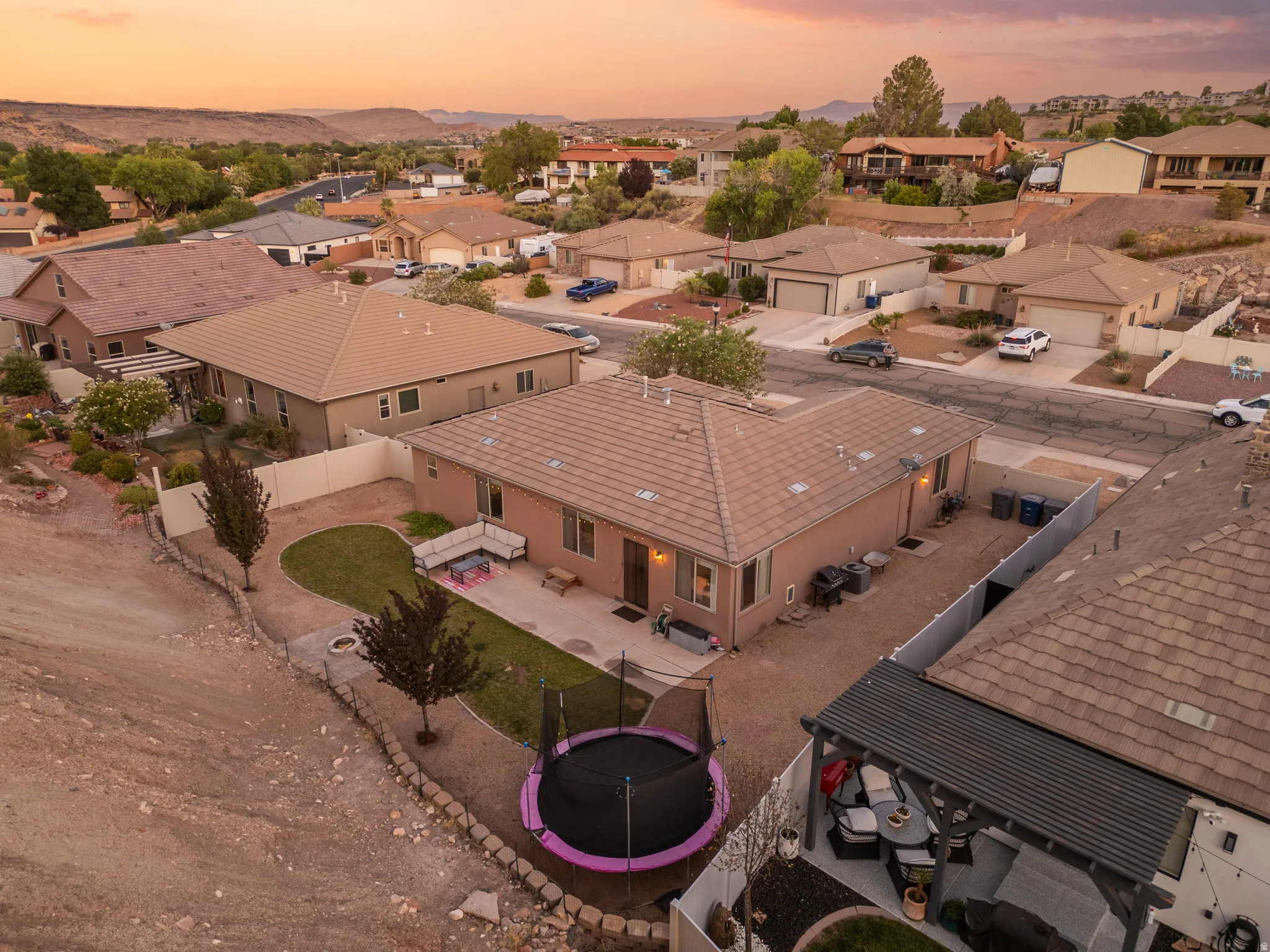 Single-story residence featuring a tile roof and stucco exterior
