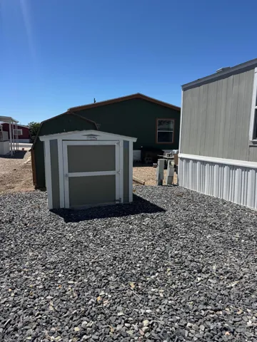 Compact outdoor storage shed with a gabled roof