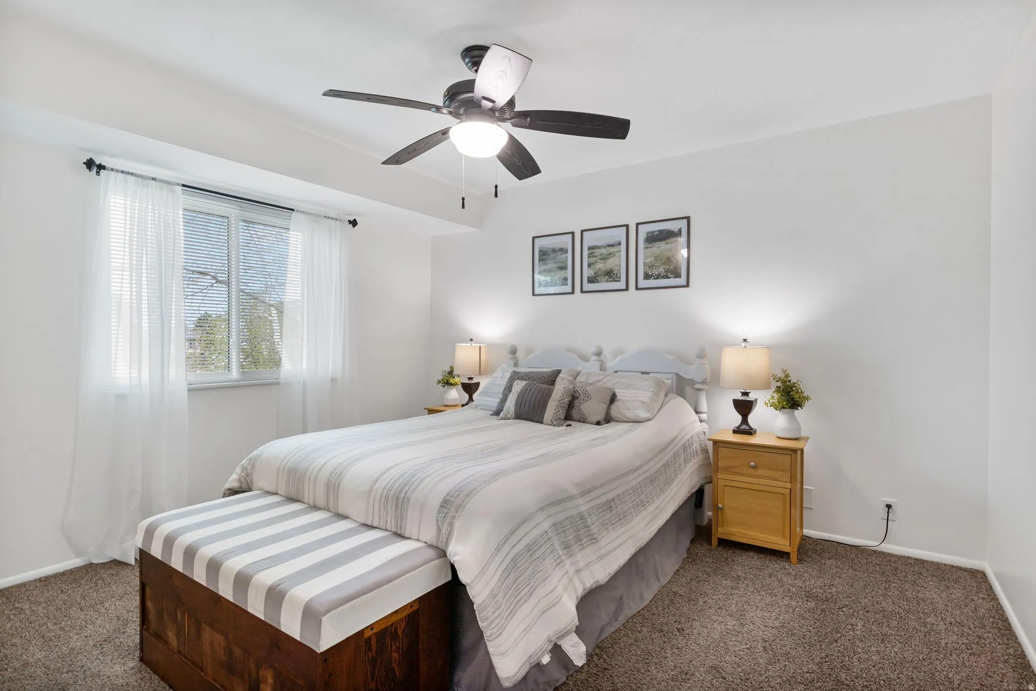 Bedroom featuring white painted walls and brown-toned carpeting