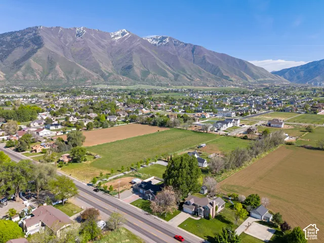 Expansive mountain range backdrop framing a residential area with varied housing styles