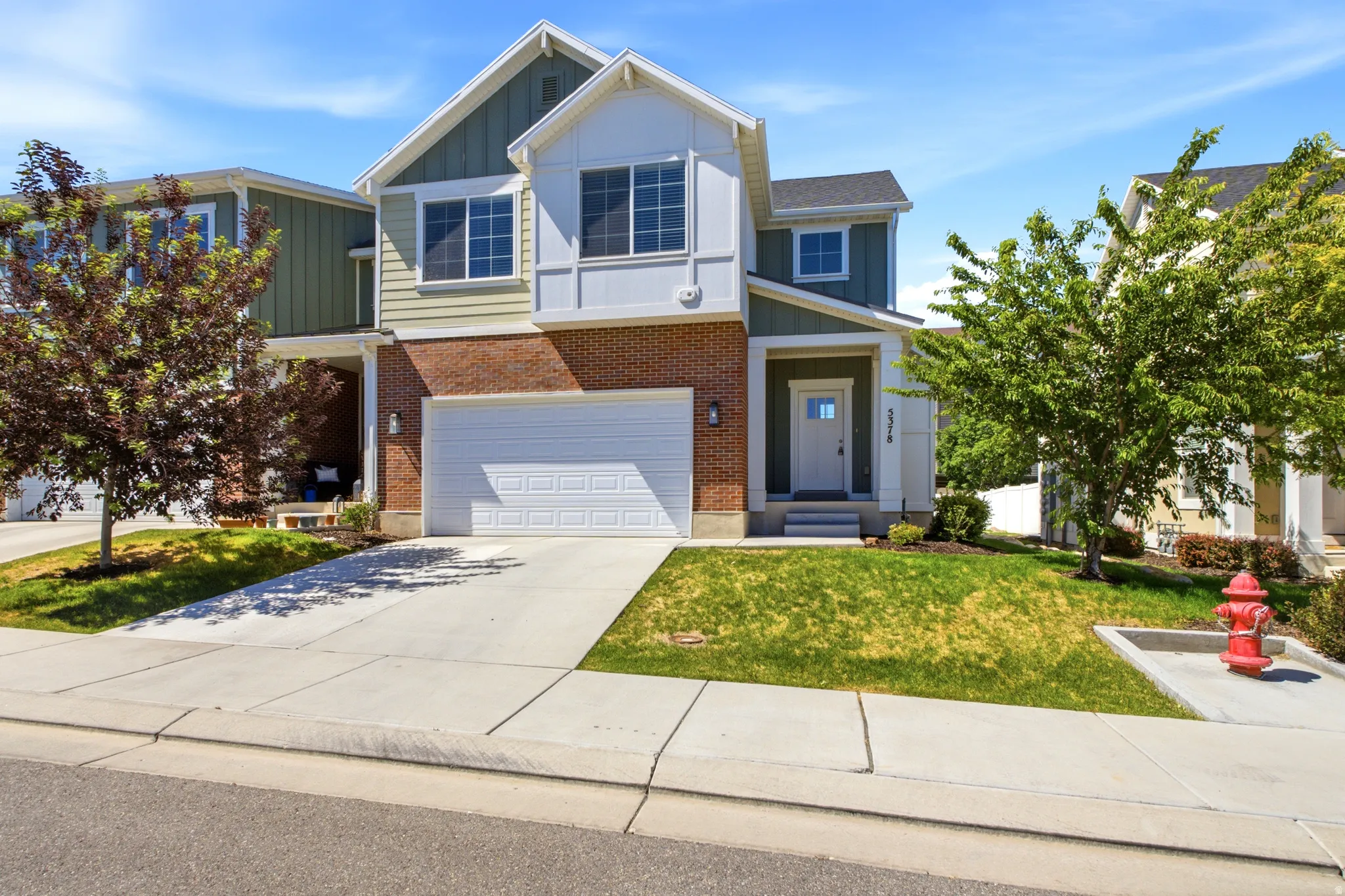 Two-story home with brick and siding exterior