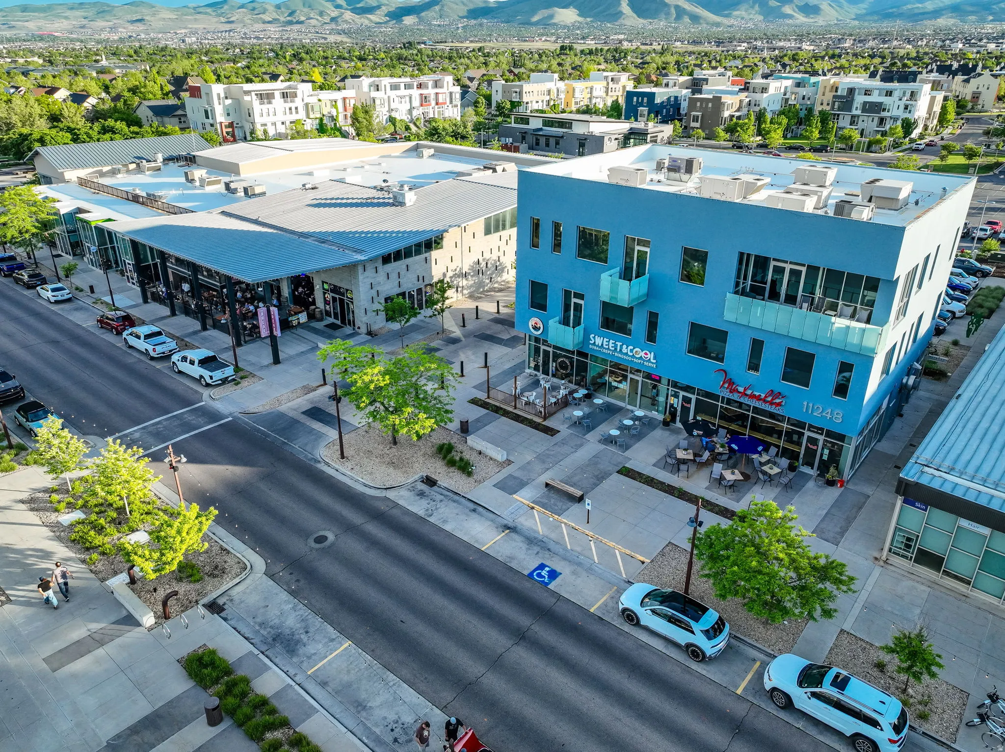 Retail and residential buildings featuring diverse architectural styles