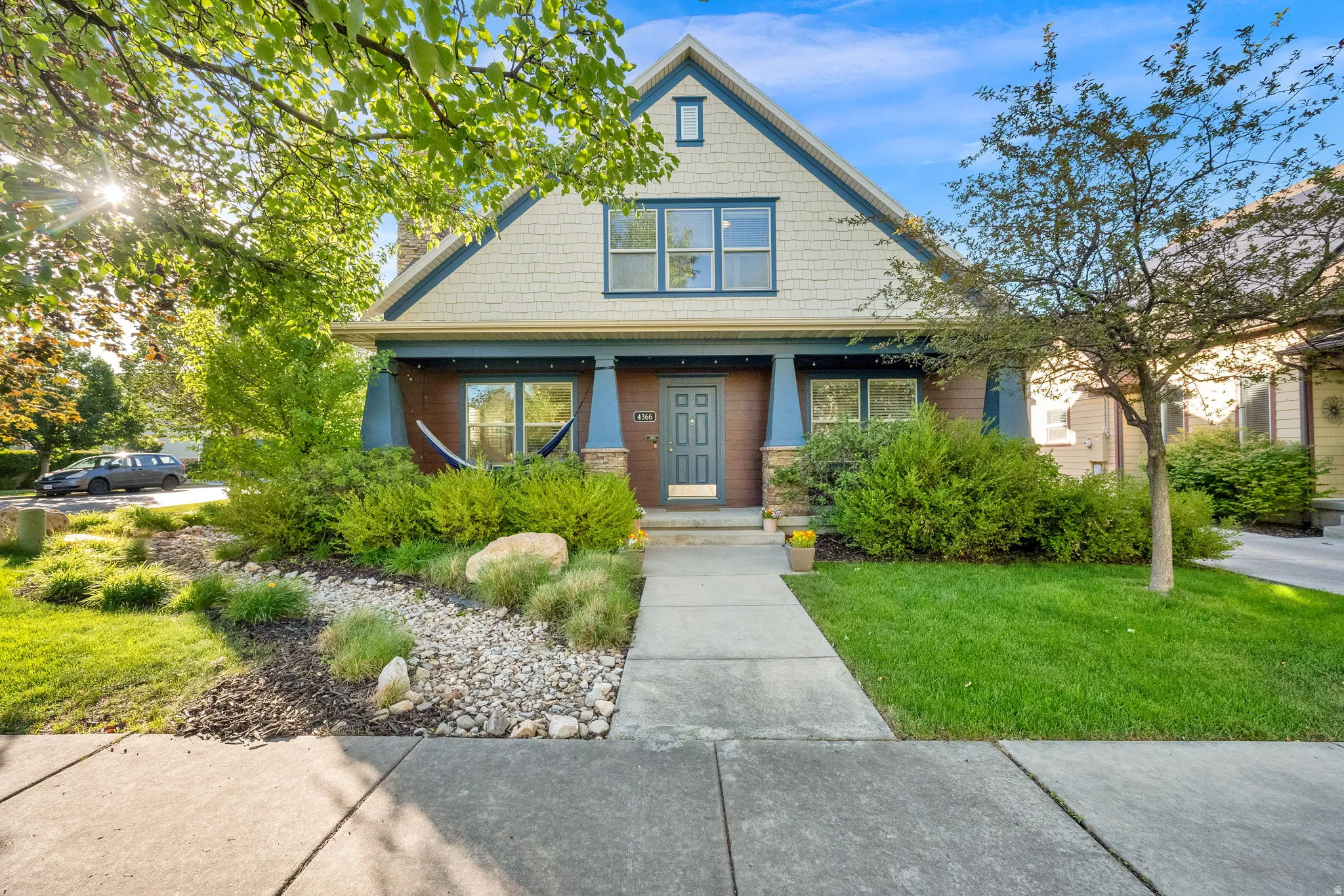 Gabled facade with shingle siding and dark trim accents
