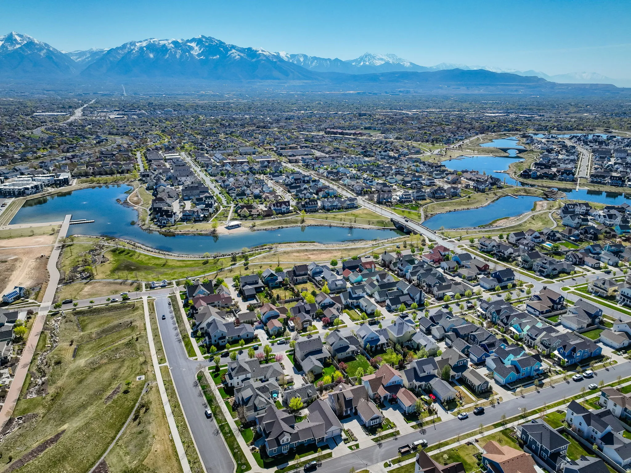 Expansive aerial view showcasing a developed residential area with numerous single-family homes