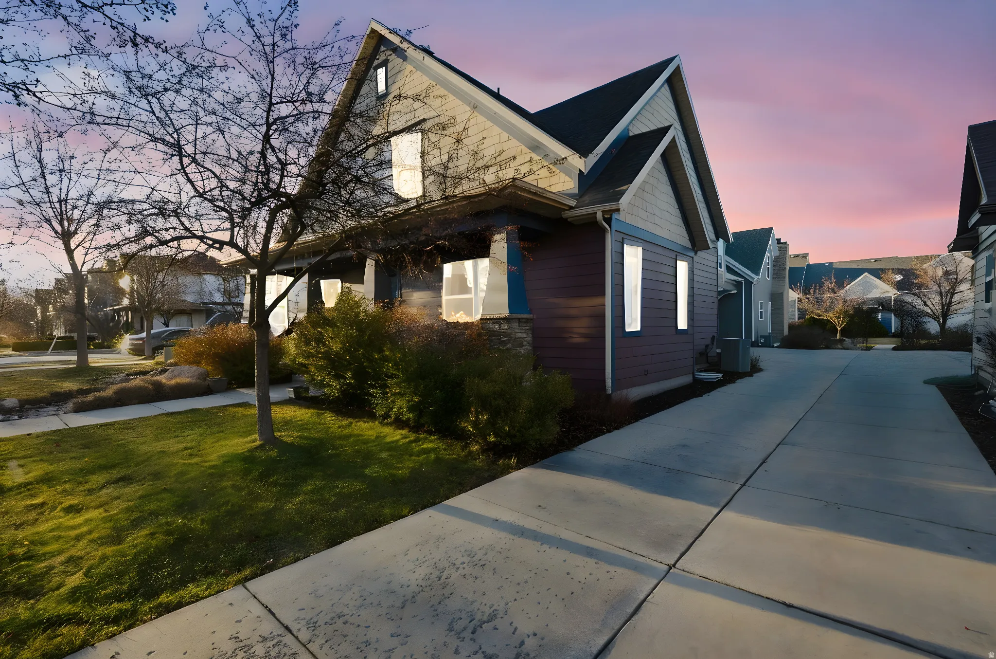 Gabled roofline with shake siding accents and a covered front porch