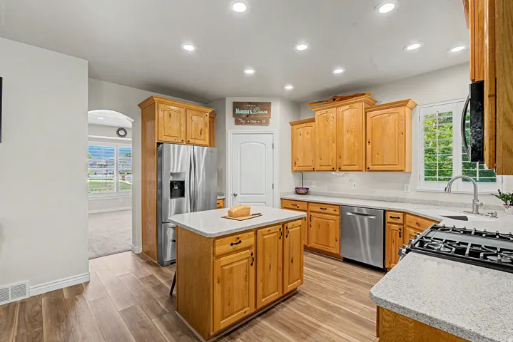 Kitchen featuring wood-finish flooring, recessed lighting, and light wood cabinetry