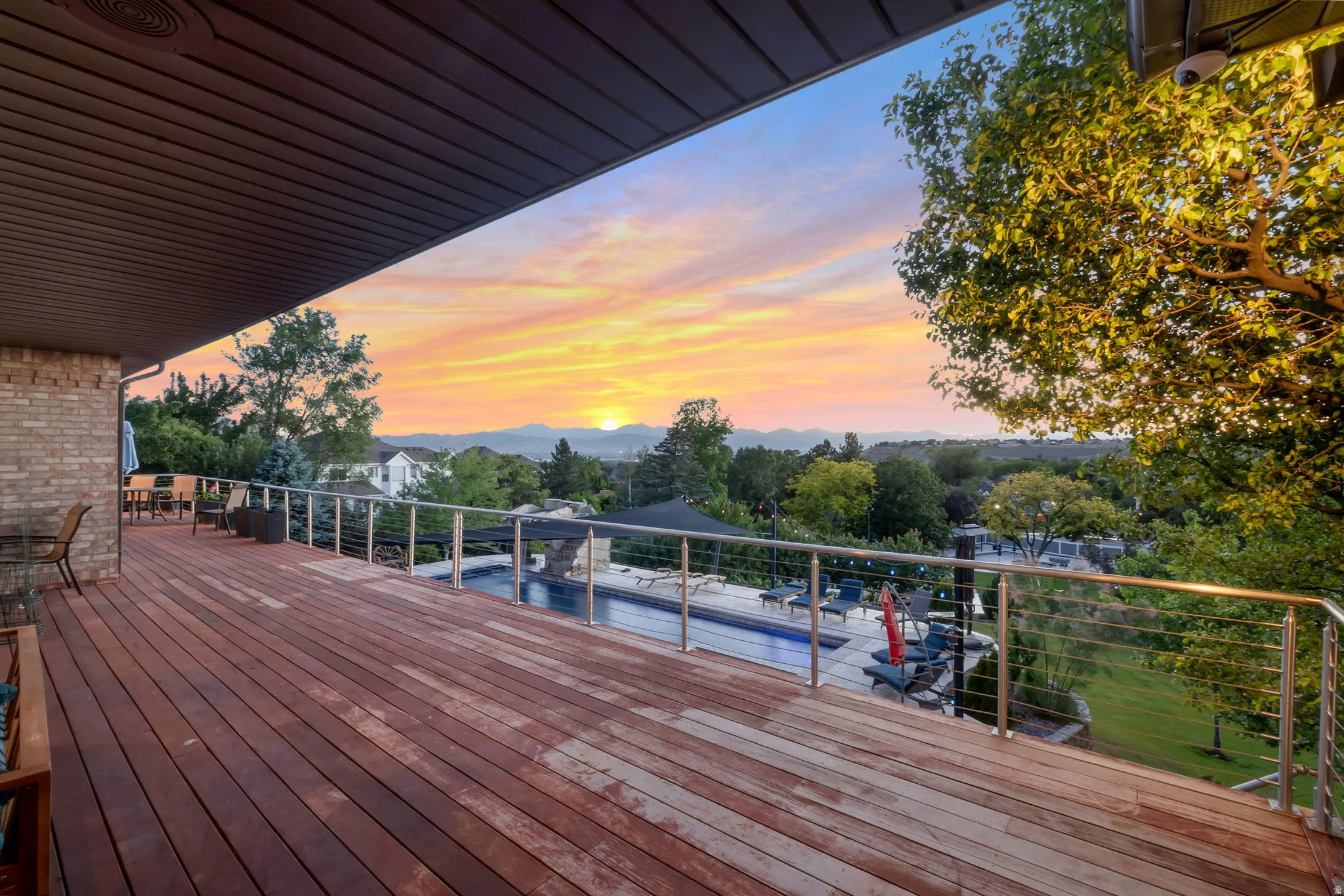 Expansive elevated 1000 + Square foot IPE Hardwood deck with stainless steel railing.