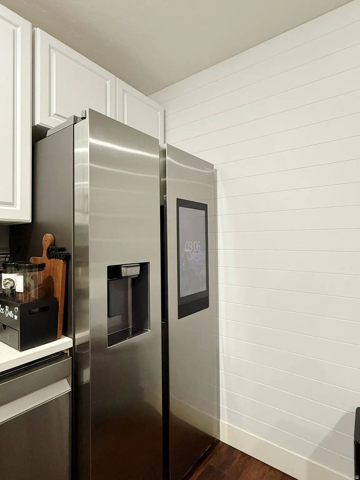 Stainless steel refrigerator with a built-in dispenser and digital display