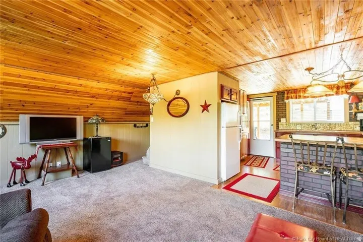 Wood-paneled ceiling with recessed lighting