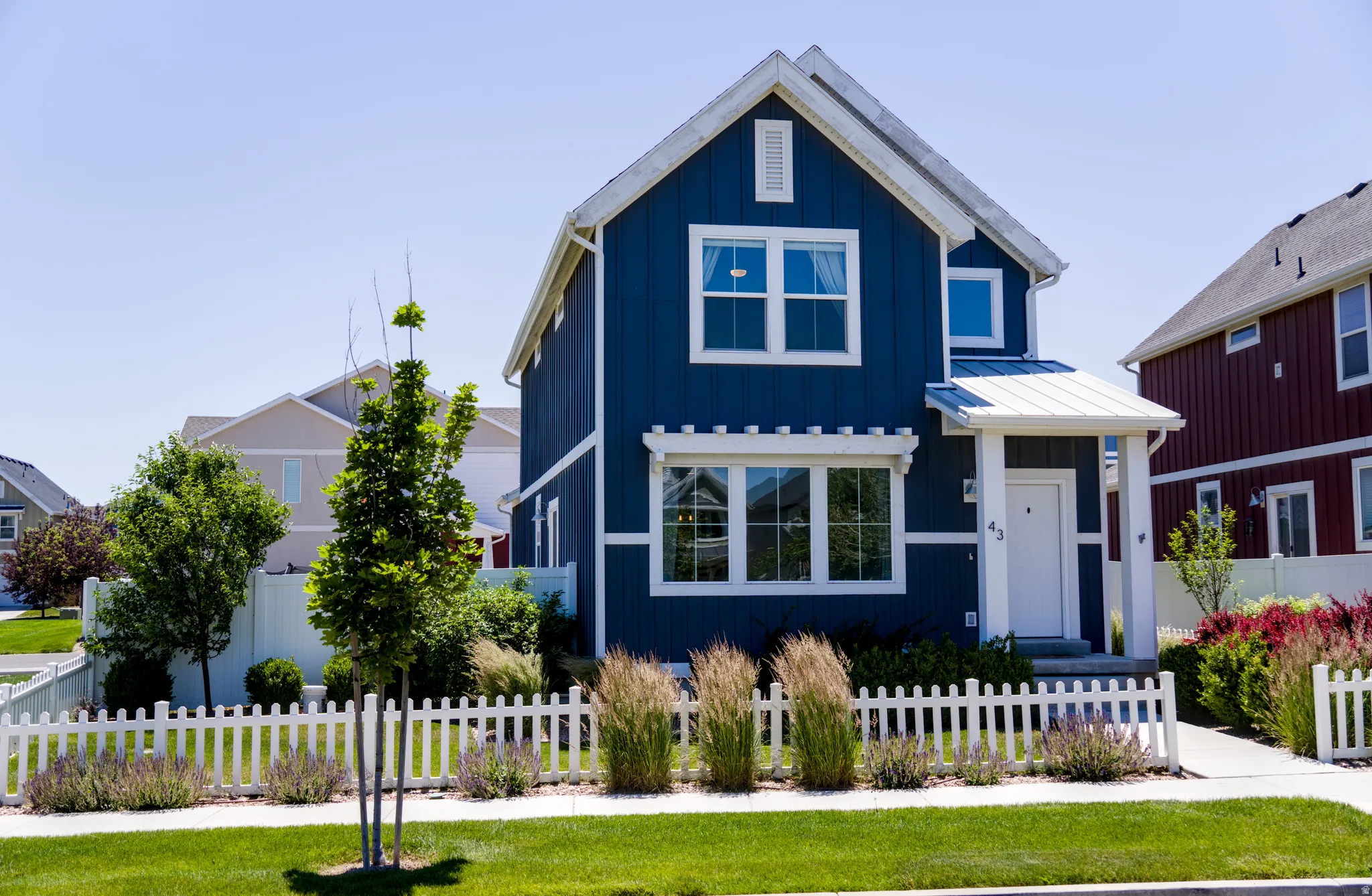 Blue siding exterior with white trim