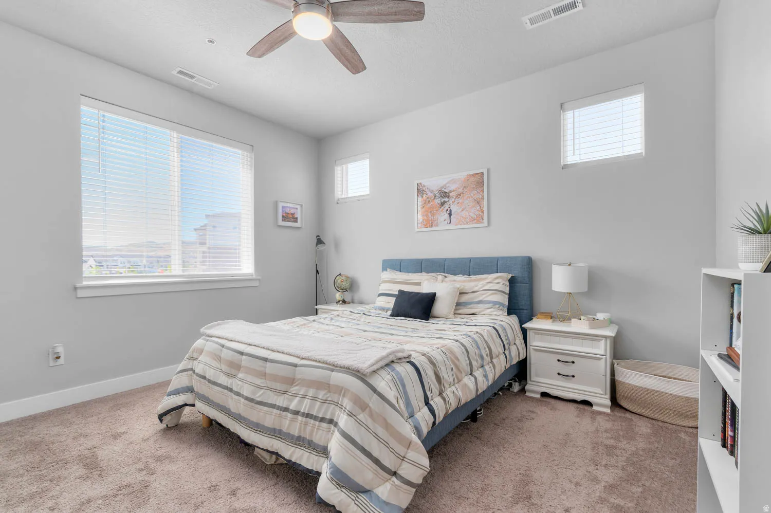 Neutral tone wall paint complements soft carpet flooring