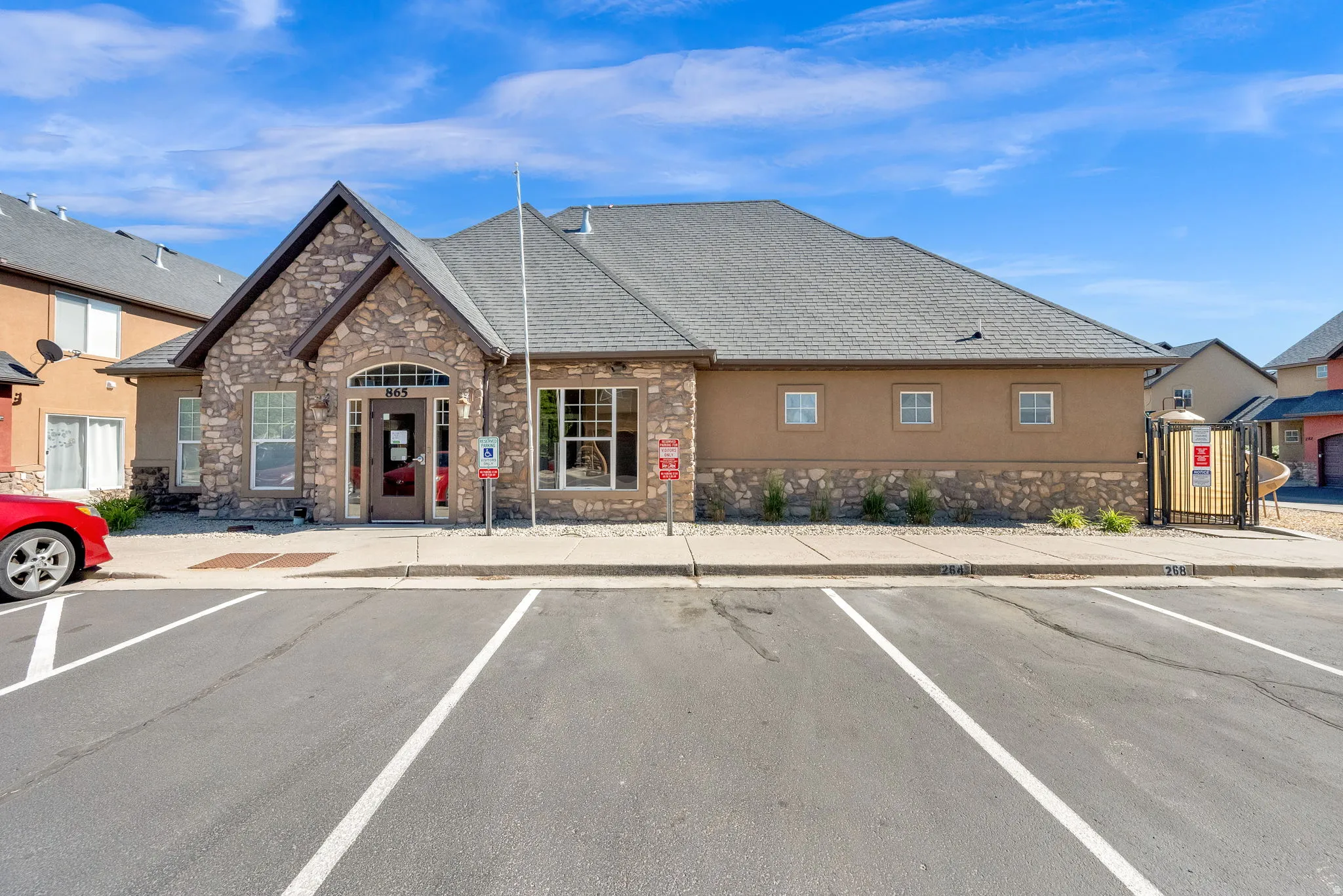 Club House-Exterior facade featuring stone veneer and stucco finishes