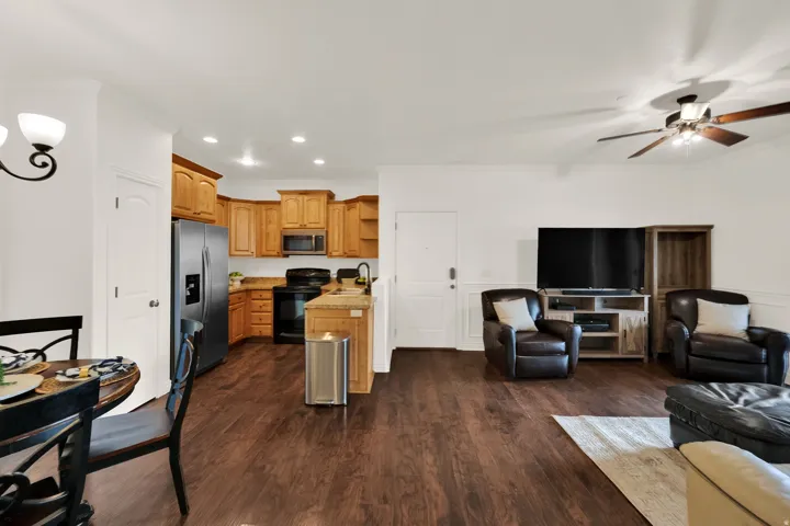 Open concept living area featuring dark wood-finish flooring