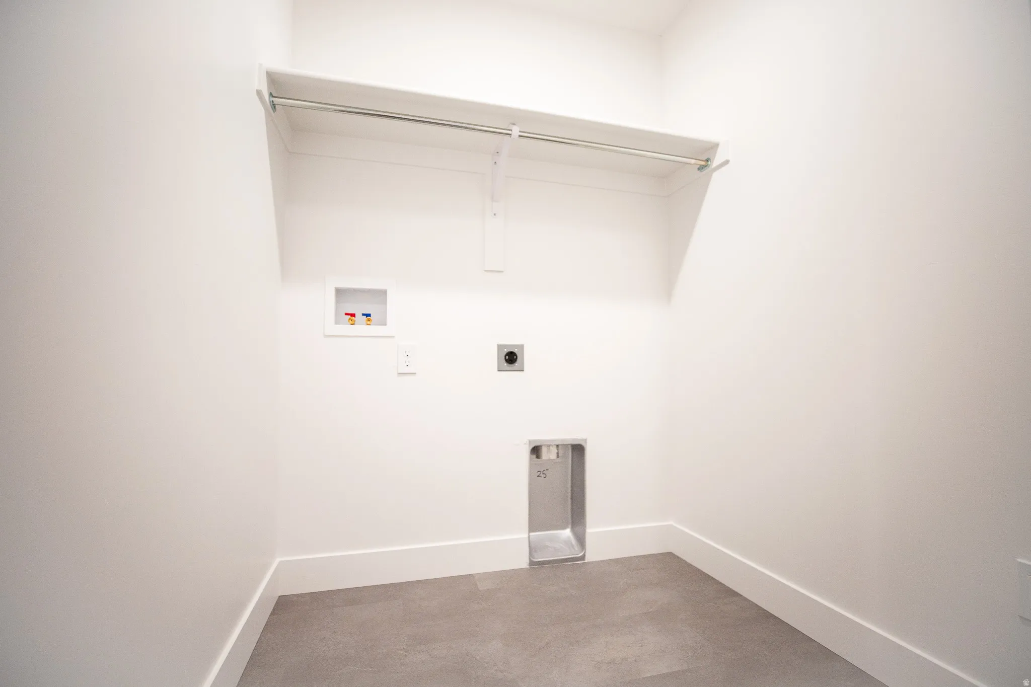 Laundry room with electric hookups for a washer and dryer