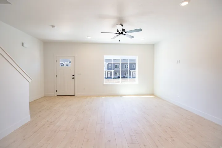 Spacious family room with view of park out the front window