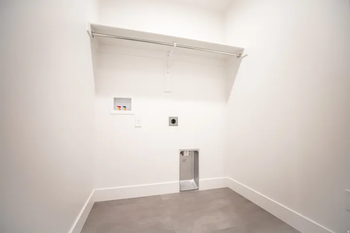 Laundry room with electric hookups for a washer and dryer