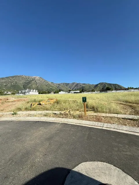 Expansive undeveloped lot featuring mountain scenery and a clear sky