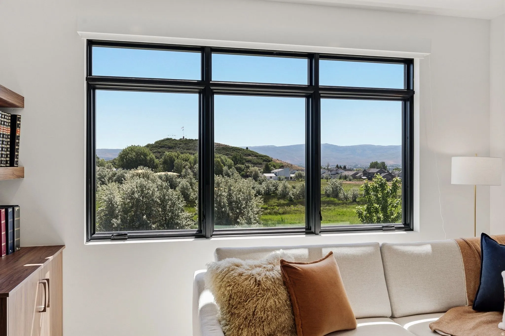 Large picture window with black framing and white trim