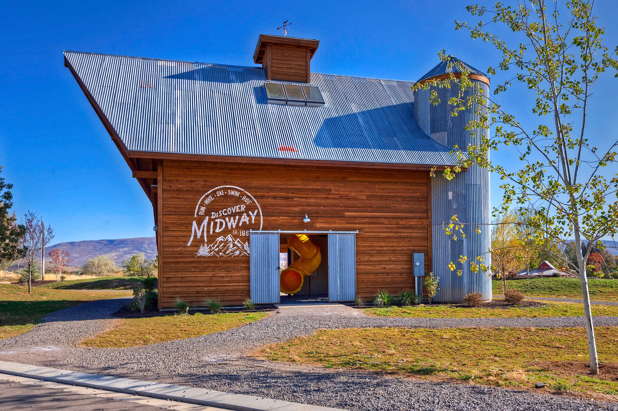 Wood-sided structure with a distinctive corrugated metal roof