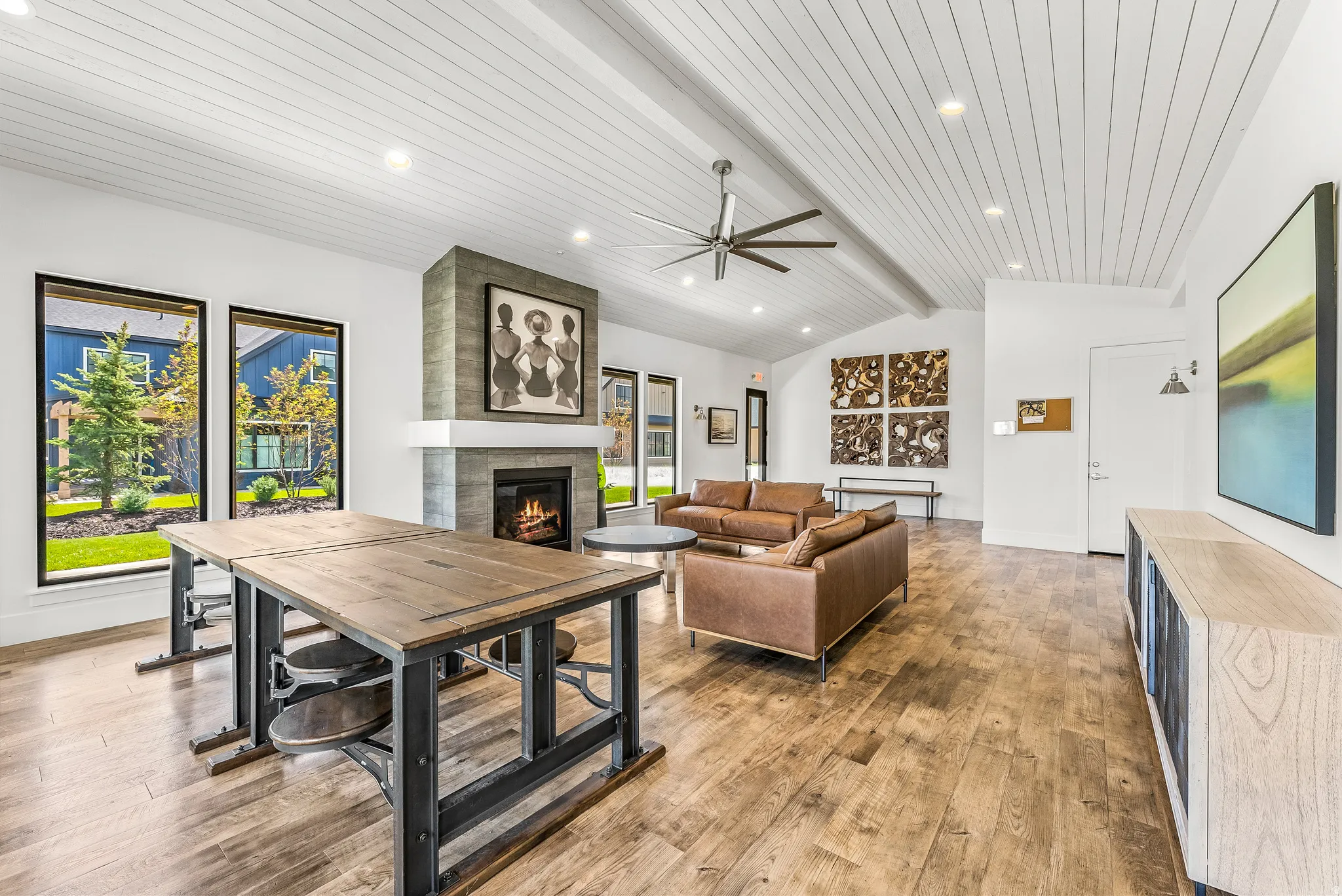Spacious interior featuring wood-finish flooring, a vaulted plank ceiling, and recessed lighting