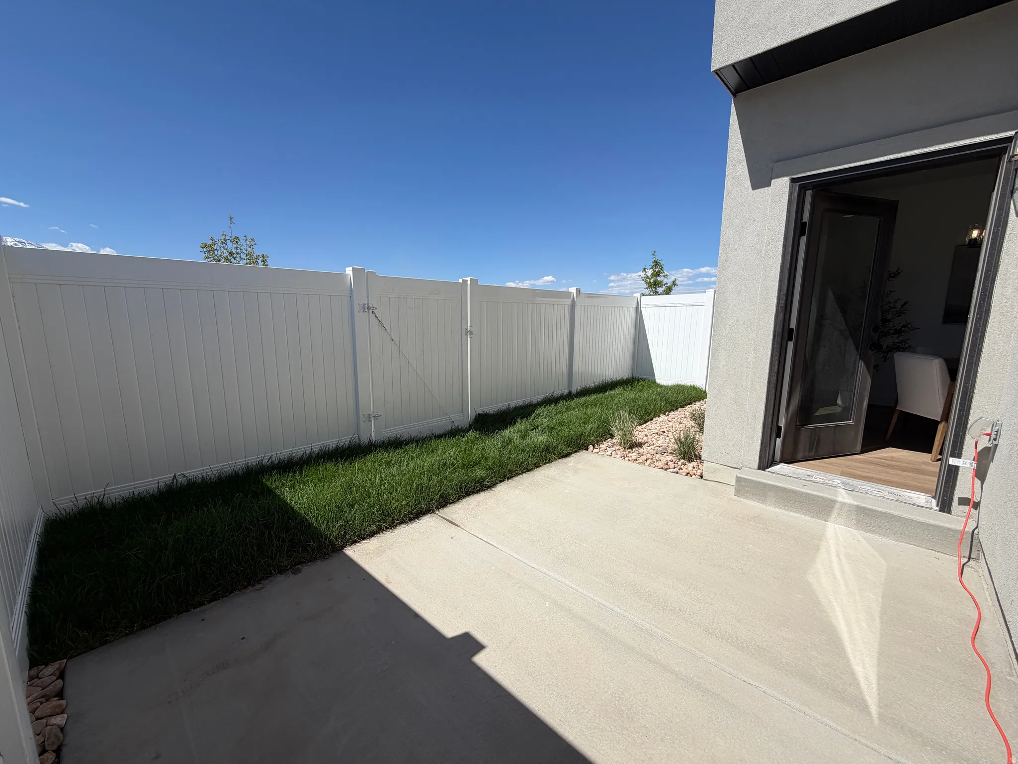 Private outdoor patio featuring concrete paving