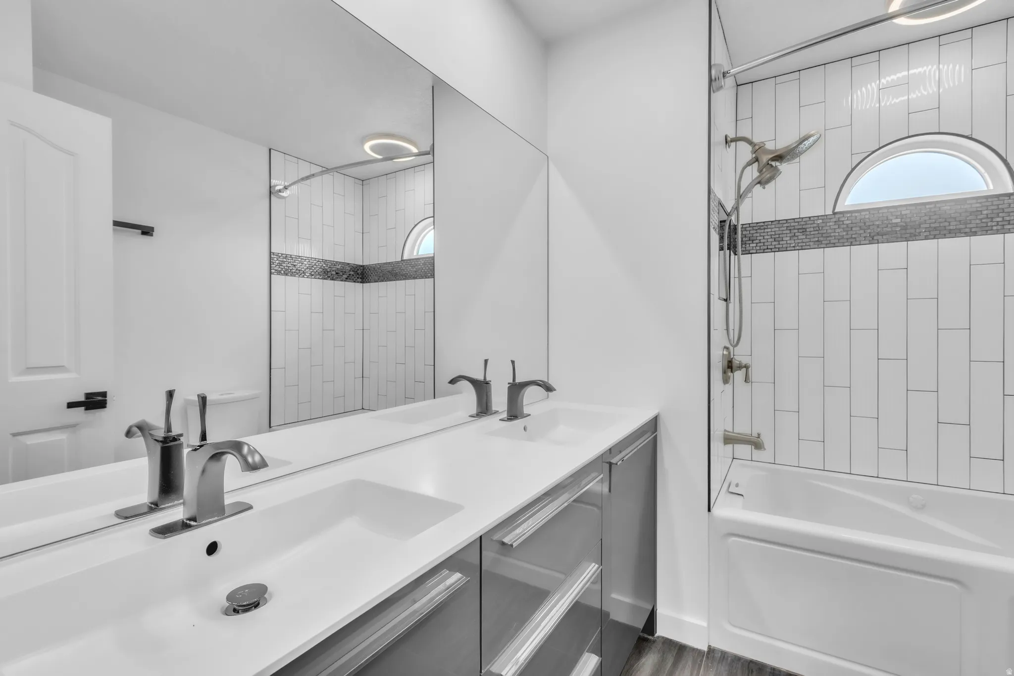 Double vanity with integrated sinks and brushed nickel faucets