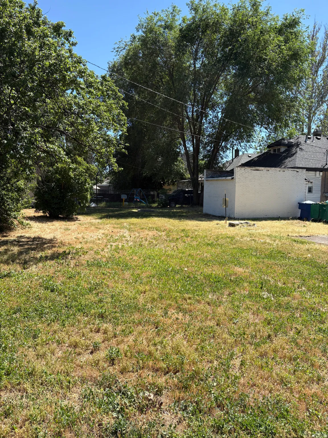 Expansive lot with mature trees providing natural shading