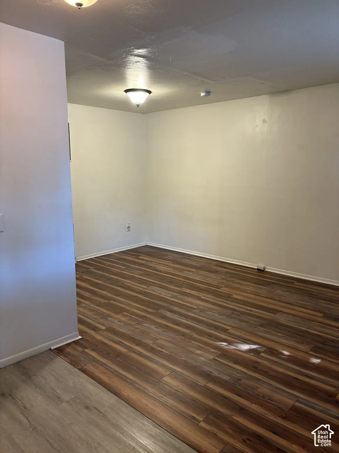 Wood-finish flooring throughout, featuring a distinct plank pattern