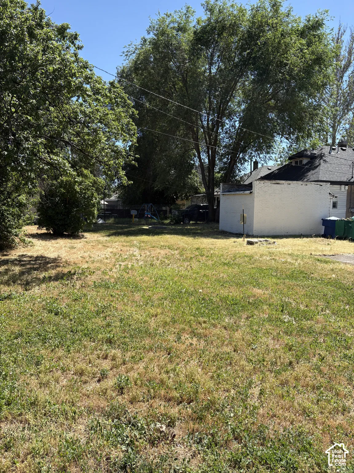 Expansive lot with mature trees providing natural shading
