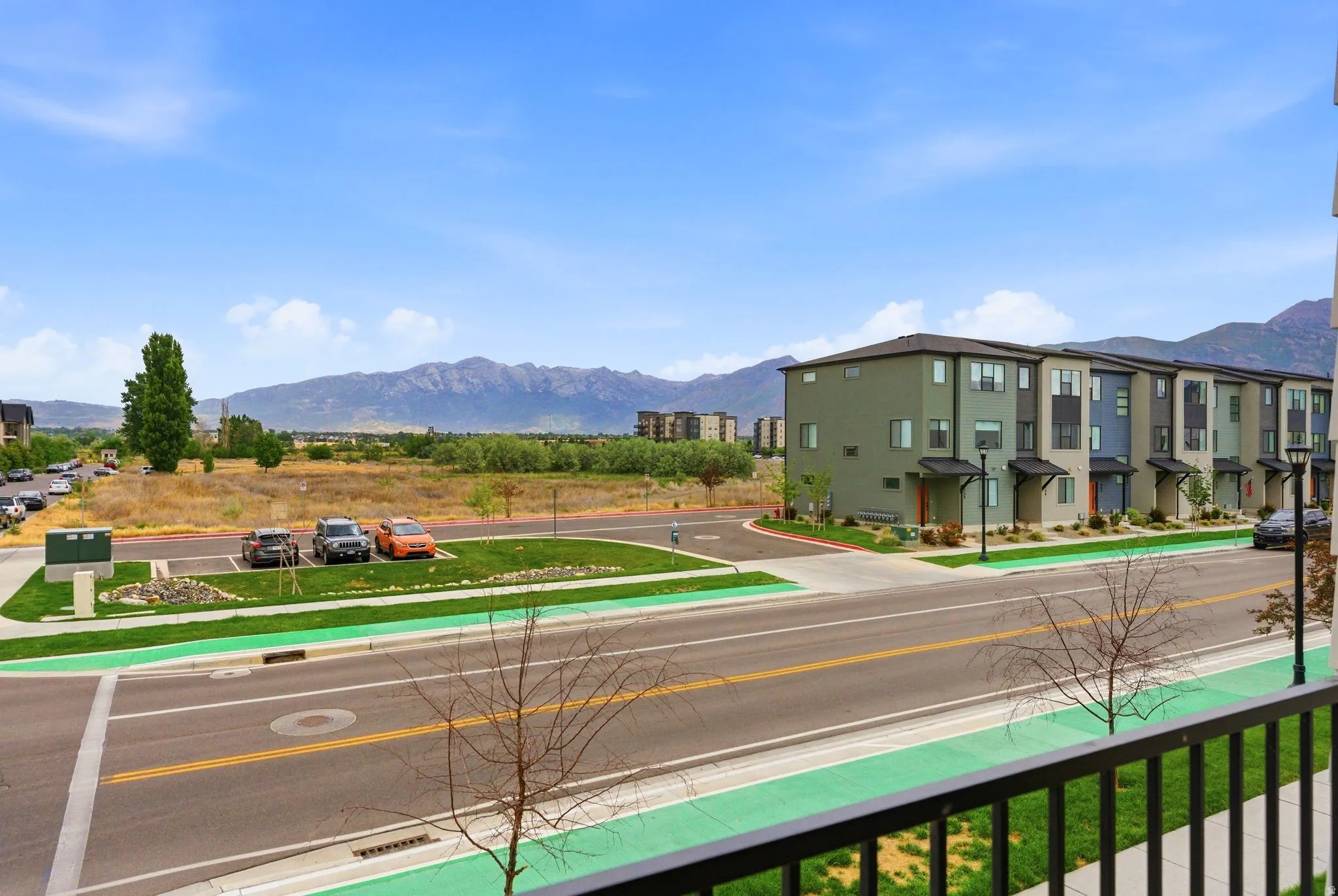Modern townhome-style residences featuring varied exterior siding and multiple window placements